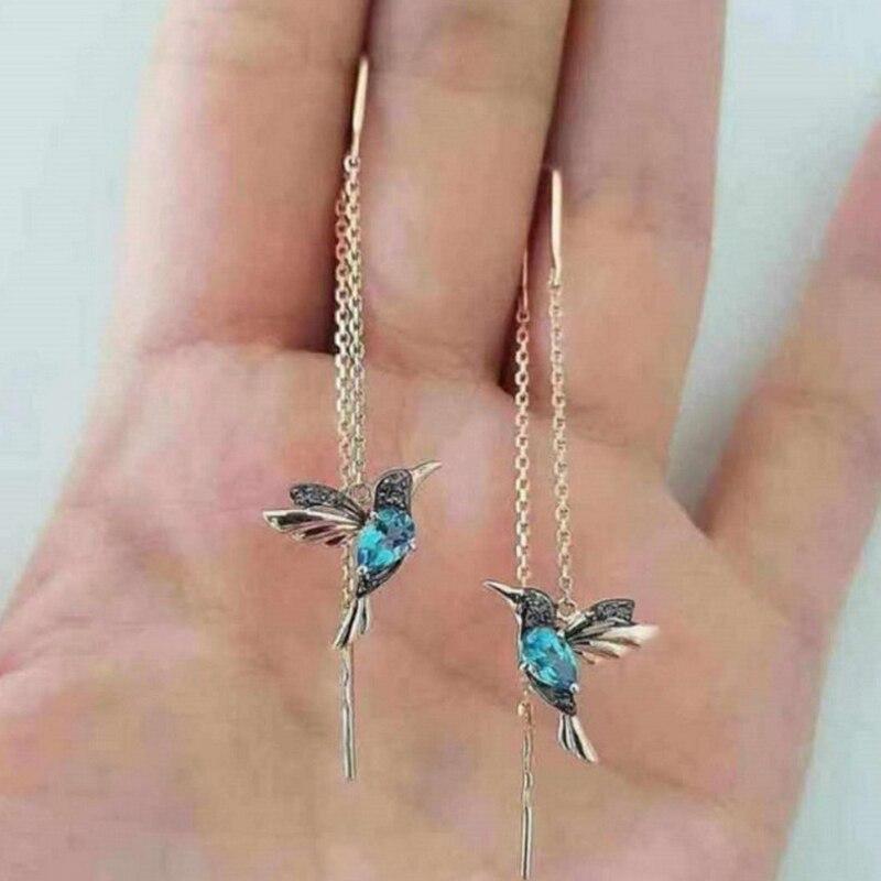 https://cdn.shopify.com/s/files/1/0569/4511/5238/files/kfH7cf02f9f065f4a0b8828cc5d8af0c6f2YPendientes-minimalistas-con-cadena-de-Color-plateado-para-mujer-aretes-largos-con-borlas-llamativos-con-personalidad_9425e5e8-2d16-4f9d-82cd-38c654.jpg?v=1729775192
